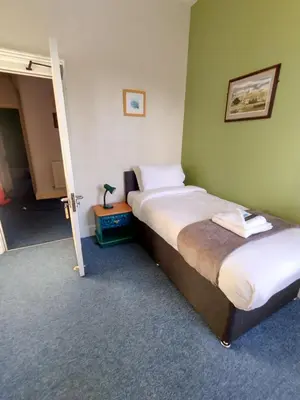 a bedroom with two beds in a room at Kington Accommodation in Kington