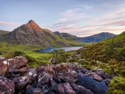 a view of a mountain range with a lake at Llety Cariad in Bala