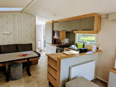 a small kitchen with a table and a counter top at Sarn Y Glyn in Mid Wales Cambrian Mountains near Llanidloes Powys in Caersws