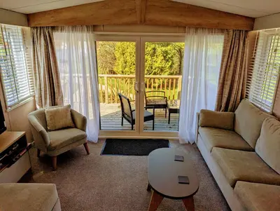 a living room with a couch and a table at Sarn Y Glyn in Mid Wales Cambrian Mountains near Llanidloes Powys in Caersws