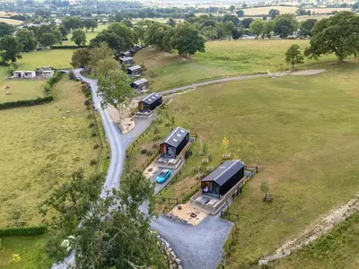 an aerial view of a house in a field at Caban Dulas in Rhayader