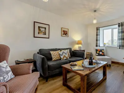 a living room with a couch and a table at 2 Bed in Llanwrtyd Wells 94009 in Beulah