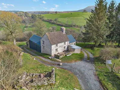 an aerial view of an old house in the countryside at 3 Bed in Brecon oc-94434 in Velindre