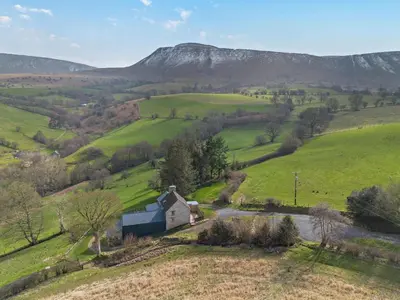 a farm in the middle of a green field at 3 Bed in Brecon oc-94434 in Velindre