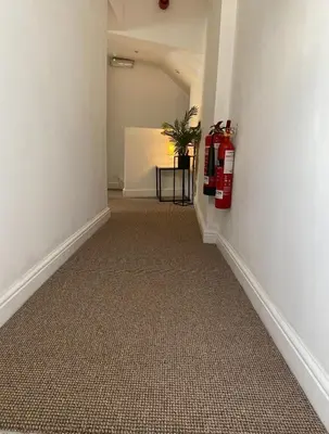 an empty hallway with a fire hydrant on the wall at Prince of wales pub and accommodation in Llangollen