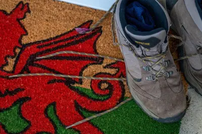 a shoe on top of a rug on a floor at Estuary Lodge Motel in Talsarnau