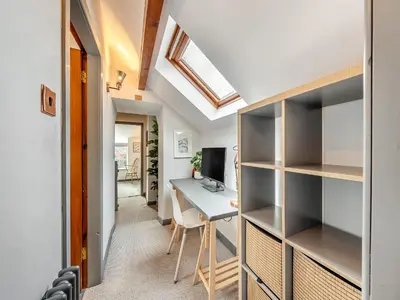 a home office with a desk and a computer at Dee Bank Cottage in Llangollen