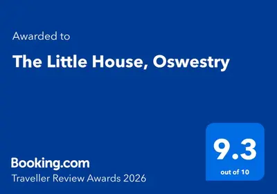 a blue screen with the title of the little house and oysterster at The Little House, Oswestry in Oswestry