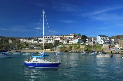 a sail boat in the water in a harbor at 3 Prospect Place New Quay in New Quay