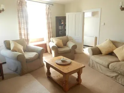 a living room with two couches and a coffee table at 3 Prospect Place New Quay in New Quay