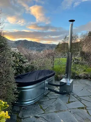a toilet sitting on top of a stone patio at Pen-Y-Bryn Cottage in Blaenau-Ffestiniog