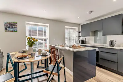 a kitchen with a table and chairs and a counter top at 2 Bed in Aberaeron oc-t29116 in Aberaeron