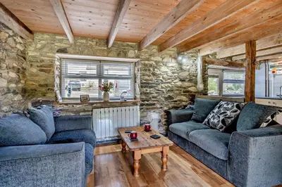 a living room with two couches and a table at 2 Bed in Cross Inn oc-t29117 in Cross Inn