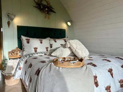 a bedroom with a bed with a horse blanket at Willow in Llanidloes