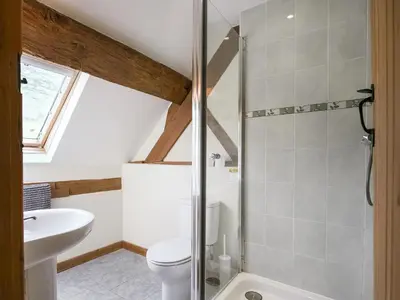 a bathroom with a toilet and a sink at Uk46589 - Kibble in Church Stretton