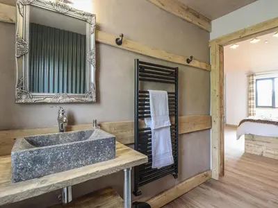 a bathroom with a sink and a mirror at Bwncath in Welshpool