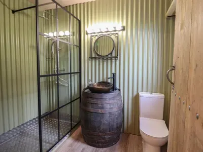 a bathroom with a barrel sink and a toilet at Bwncath in Welshpool