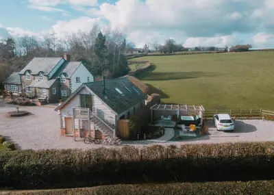 a house with a car parked in front of it at Hafan in Glasbury