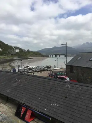 a view of a marina with boats in the water at Harbour House in Barmouth