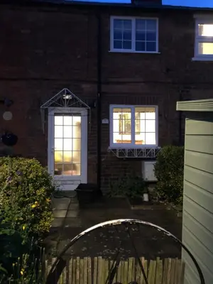 a house with two windows and a white door at Simply Shrewsbury, by Severn Theatre & Quarry Park in Shrewsbury