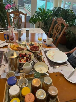a table with plates of food on top of it at Twyford Homestay B&B in Llandrindod Wells