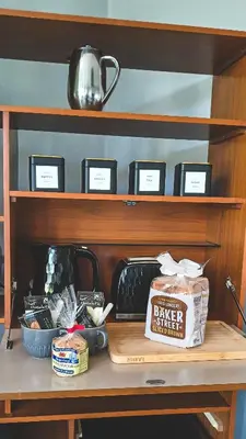 a table with a bag of food on a shelf at Amazing Cader views Torrent en suite in Dolgellau