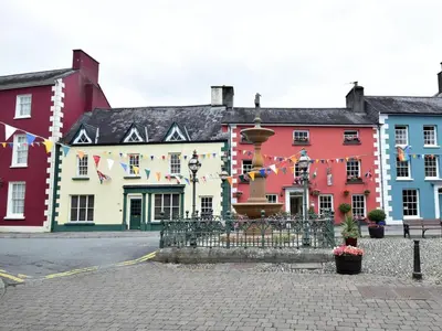 a group of buildings with flags in a street at 1 Bed in Cilycwm oc-t29297 in Cilycwm