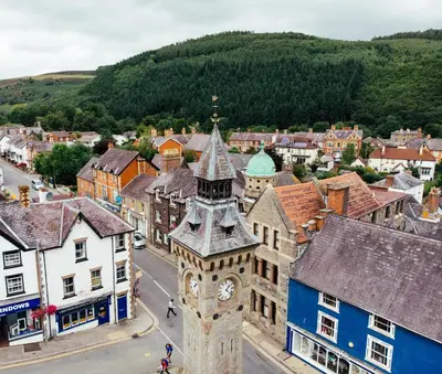 an aerial view of a town with a clock tower at 3 Bed in Knighton oc-b29329 in Felindre