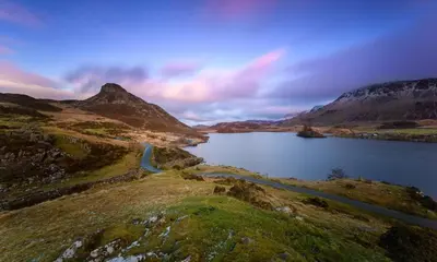 a lake in the middle of a mountain at 5 Bed in Bontddu oc-c29184 in Penmaenpool