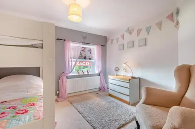 a bedroom with a bed and a dresser and a window at 3 Bed in Clyro oc-r29347 in Clyro