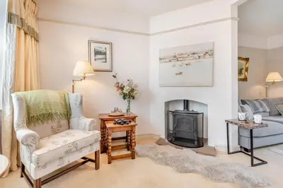 a living room with a chair and a fireplace at 3 Bed in Clyro oc-r29347 in Clyro