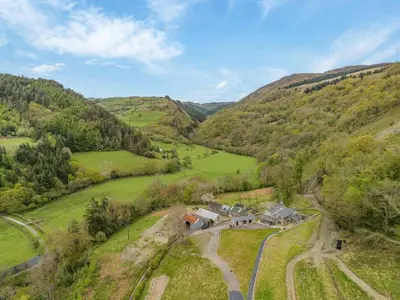 an aerial view of a farm in the hills at 4 Bed in Derwenlas oc-c29244 in Machynlleth