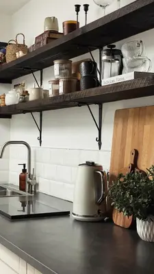 a kitchen with a counter top with a tea kettle at Poets Cottage Eglwys Fach in Scyborycoed