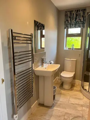 a bathroom with a sink and a toilet at Lilac Cottage in Stoke Prior