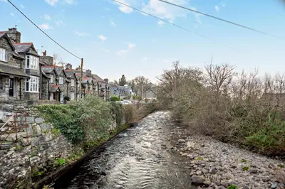 a river in a town with houses and buildings at 3 Bed in Llanbedr oc-t28932 in Llanbedr