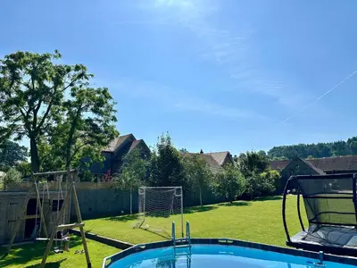 a backyard with a pool with a goal at Serafina Lodge in Leominster