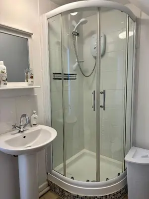 a bathroom with a shower and a sink at Serafina Lodge in Leominster