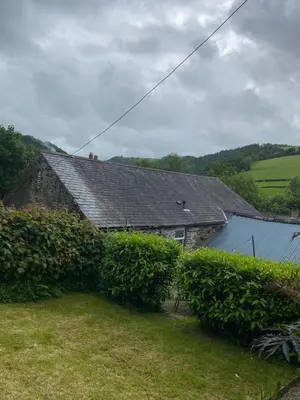 a house with bushes in front of it at The chapel in Machynlleth