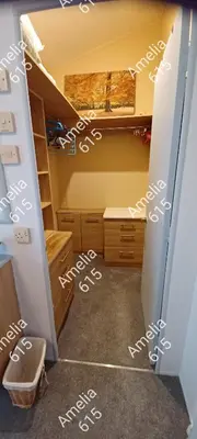 a room with a closet with white writing on it at Amelia 615 Barmouth in Talybont