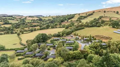 an aerial view of a village in the hills at Dam View Shepherds Hut in Rhayader