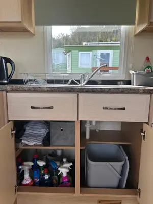 a kitchen counter with a sink and a window at MoonStone in Aberystwyth