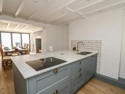 a kitchen with a sink and a counter top at Osborne House in Rhayader