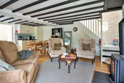 a living room with a couch and chairs and a table at Finest Retreats - Hermon Bach in Dolgellau