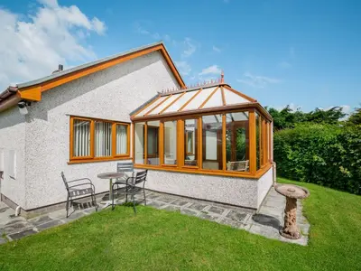 a house with a gazebo in the yard at Tremyfron in Bala