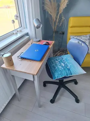 a desk with a laptop and a chair next to a window at Brynarfor near Aberaeron in Llanon