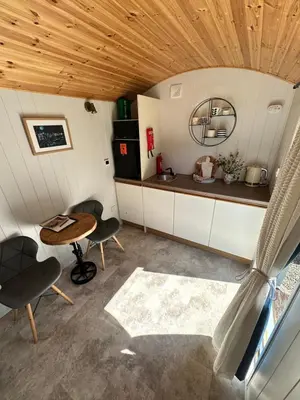 an overhead view of a kitchen in a tiny house at Cwt Bugail Aeron in Aberaeron