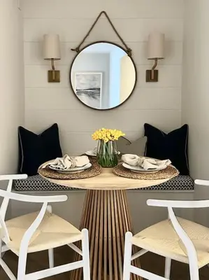 a table with two chairs and a mirror in a room at Tobias Apartment, 2 Bedroom, Aberaeron in Aberaeron