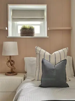 a bedroom with a bed with a window and a pillow at Tobias Apartment, 2 Bedroom, Aberaeron in Aberaeron