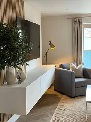 a living room with a tv and a couch at Tobias Apartment, 2 Bedroom, Aberaeron in Aberaeron