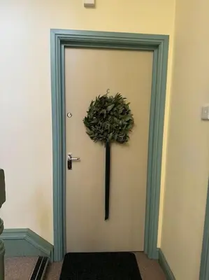 a door with a plant on the side of it at The Nook Castle Street Ludlow in Ludlow